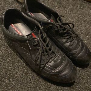 Mens Prada black leather sneakers .